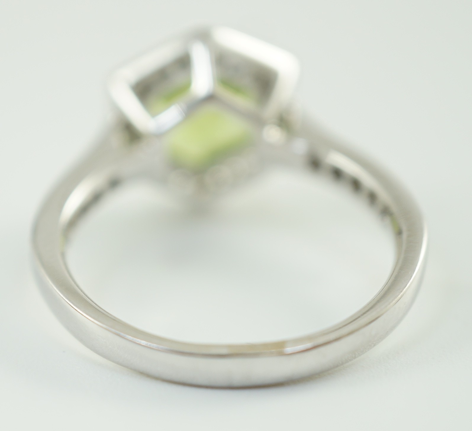 A modern 18ct white gold, peridot and diamond set hexagonal cluster set dress ring